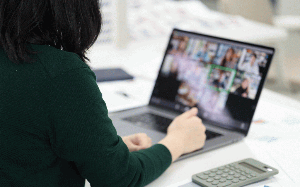 Woman taking part in online meeting on laptop