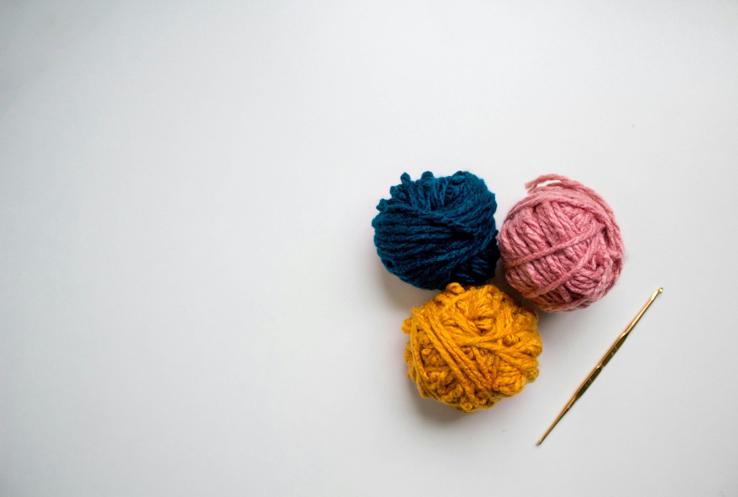 Balls of yarn with crochet hook