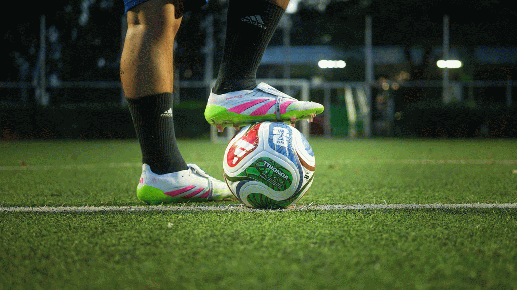 A football player's foot resting on a World Cup 2026 football