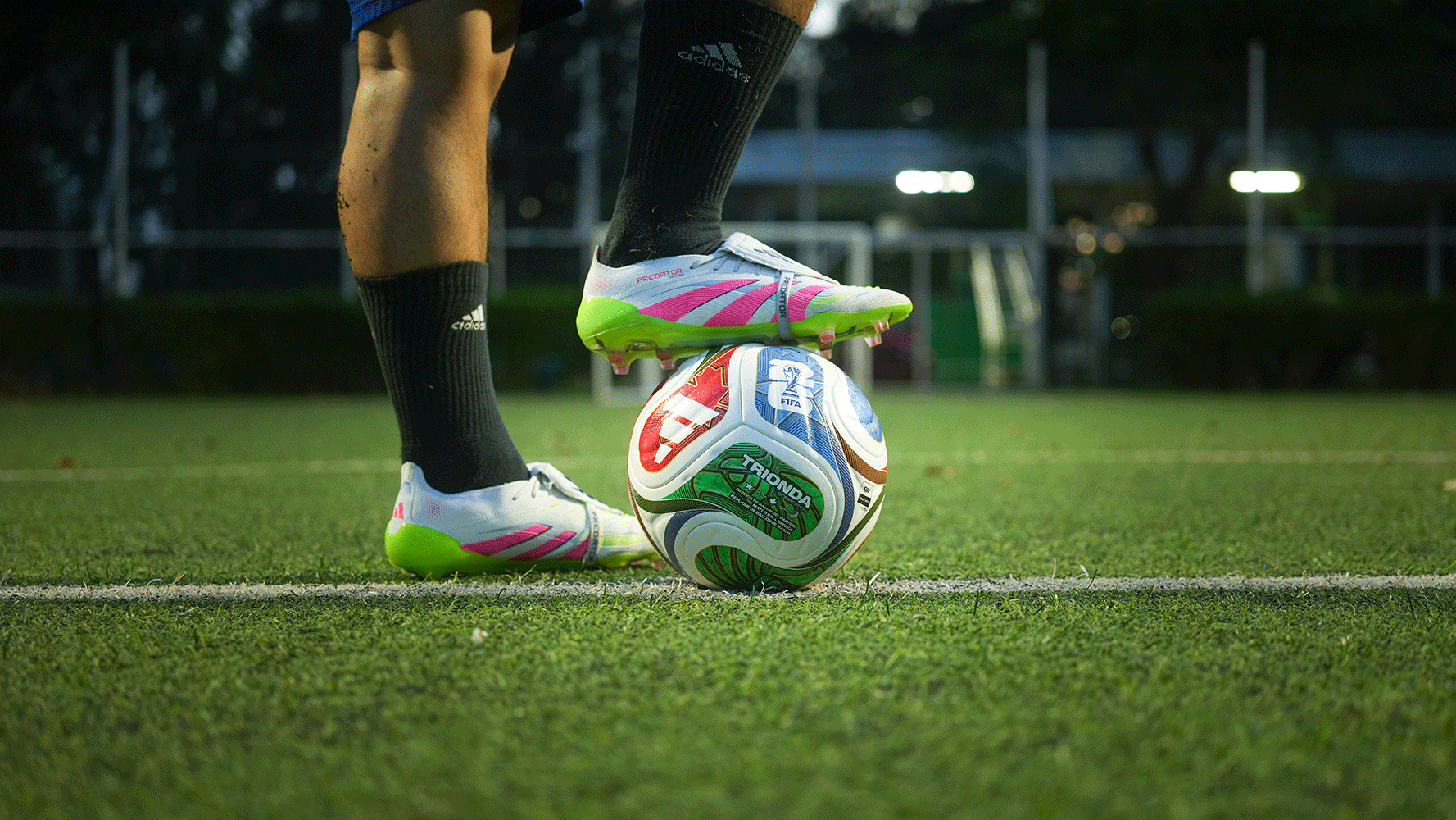 A football player's foot resting on a World Cup 2026 football