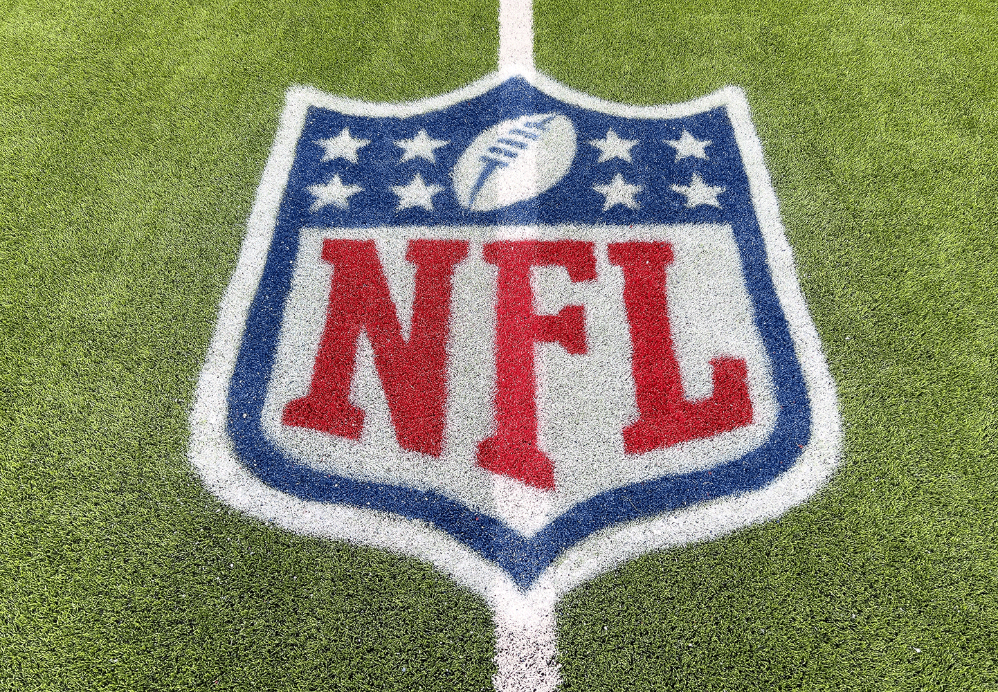 The NFL logo painted on a football pitch