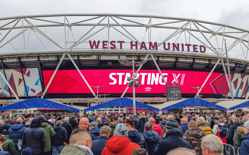 Exterior of West Ham United stadium with crowds of supporters